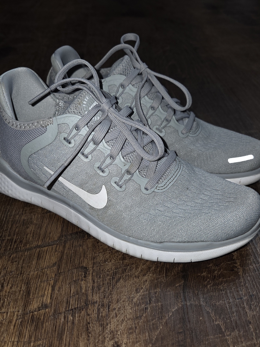 Nike Women’s Light Gray Athletic Sneakers with White Swoosh